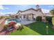 Inviting backyard oasis with pool, putting green, patio, outdoor dining and mountain views at 2212 Sierra Heights Dr, Las Vegas, NV 89134