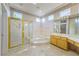 Elegant bathroom with a large tub, glass shower, and spacious vanity, perfect for relaxation at 2212 Sierra Heights Dr, Las Vegas, NV 89134