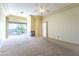 Spacious carpeted bedroom with a fireplace and sliding glass doors to the outdoor space and stunning views at 2212 Sierra Heights Dr, Las Vegas, NV 89134