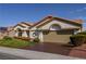 Inviting one-story home boasts a tiled roof, well manicured yard and a two car garage at 2212 Sierra Heights Dr, Las Vegas, NV 89134