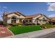 Inviting single story home with lush green artificial lawn and desert landscaping at 2212 Sierra Heights Dr, Las Vegas, NV 89134