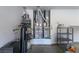 Garage interior featuring the home's water heater, dual HVAC units, and storage shelving at 2212 Sierra Heights Dr, Las Vegas, NV 89134
