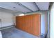 Spacious garage featuring built-in wooden storage cabinets along one wall for optimal organization and space-saving at 2212 Sierra Heights Dr, Las Vegas, NV 89134