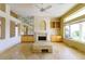 Spacious living room with marble floors, a fireplace, and built-in shelving for storage and display at 2212 Sierra Heights Dr, Las Vegas, NV 89134