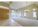 Bright living room with soaring tray ceilings, large windows, and an elegant chandelier at 2212 Sierra Heights Dr, Las Vegas, NV 89134