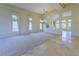 Spacious open living room with elegant chandelier and large windows at 2212 Sierra Heights Dr, Las Vegas, NV 89134