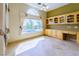 Office space with built-in cabinets, large windows overlooking the pool, and abundant natural light at 2212 Sierra Heights Dr, Las Vegas, NV 89134