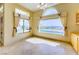 Bright office space with large windows, a view of the pool, and manicured landscaping at 2212 Sierra Heights Dr, Las Vegas, NV 89134