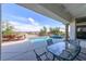 Outdoor patio with a pool, jacuzzi, manicured yard, and stunning mountain views at 2212 Sierra Heights Dr, Las Vegas, NV 89134