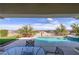 Outdoor patio with a pool, jacuzzi, manicured yard, and views of the surrounding valley at 2212 Sierra Heights Dr, Las Vegas, NV 89134