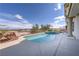 Sparkling pool and jacuzzi with manicured landscaping offering a stunning backdrop of the valley at 2212 Sierra Heights Dr, Las Vegas, NV 89134