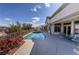 Beautiful pool and jacuzzi with a covered patio creating the perfect outdoor oasis at 2212 Sierra Heights Dr, Las Vegas, NV 89134