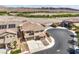 Aerial view of a two-story home located on a cul-de-sac with mountain views at 228 Via Vallisneri, Henderson, NV 89011