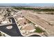 Beautiful aerial view of a home with an inviting private pool and manicured landscaping near desert landscape at 228 Via Vallisneri, Henderson, NV 89011