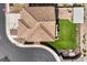 Detailed aerial shot showcasing a clay tile roof, well-kept backyard, and outdoor living area with a pergola at 228 Via Vallisneri, Henderson, NV 89011