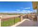 Relax on this elevated back patio with serene desert views and ample seating space for outdoor enjoyment at 228 Via Vallisneri, Henderson, NV 89011