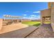 Outdoor backyard oasis with deck, bbq, patio space, synthetic grass, and views of the mountains and desert at 228 Via Vallisneri, Henderson, NV 89011
