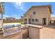 Backyard patio is great for entertaining, features a built-in grill and spacious grass for the to play at 228 Via Vallisneri, Henderson, NV 89011