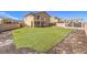 Expansive artificial turf backyard features a pergola, patio and room for entertaining at 228 Via Vallisneri, Henderson, NV 89011