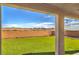 Inviting backyard features synthetic lawn for low maintenance and a covered patio perfect for outdoor entertaining at 228 Via Vallisneri, Henderson, NV 89011