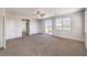 Large bedroom with neutral carpet, and access to doors and windows at 228 Via Vallisneri, Henderson, NV 89011
