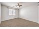 Bedroom with neutral carpet, a ceiling fan, and a window at 228 Via Vallisneri, Henderson, NV 89011