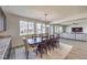 Elegant dining room with seating for eight and seamless flow to living room at 228 Via Vallisneri, Henderson, NV 89011