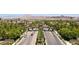 Grand community entrance lined with palm trees and lush landscaping welcoming you home at 228 Via Vallisneri, Henderson, NV 89011