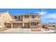 Two-story home with desert landscaping, tiled roof, and a three-car garage at 228 Via Vallisneri, Henderson, NV 89011