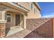 Inviting front entrance with brick wall, covered entryway, and cozy welcome mat at 228 Via Vallisneri, Henderson, NV 89011