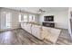 Bright living room with hardwood floors, large sectional, and backyard access at 228 Via Vallisneri, Henderson, NV 89011