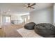 Upstairs loft area with neutral carpet and railing overlooking staircase featuring two beanbag chairs at 228 Via Vallisneri, Henderson, NV 89011
