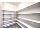 Walk-in pantry with ample shelving for organized storage and easy access in the kitchen area at 228 Via Vallisneri, Henderson, NV 89011