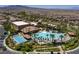 Amazing aerial view of a large community pool and recreational area surrounded by tropical landscaping at 228 Via Vallisneri, Henderson, NV 89011