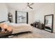 Cozy bedroom features neutral carpeting, and a comfortable queen-size bed at 25 Barbara Ln # 38, Las Vegas, NV 89183