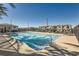 Community pool with ample lounge seating, tables and umbrellas at 25 Barbara Ln # 38, Las Vegas, NV 89183