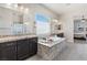 Bathroom with dual vanities, granite countertops, soaking tub, and an open view into the bedroom at 274 Chartan Ave, Las Vegas, NV 89183