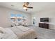 Bright bedroom featuring neutral paint, carpet flooring, large windows, and access to the backyard at 274 Chartan Ave, Las Vegas, NV 89183