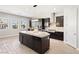 Modern kitchen features a large island, stainless steel appliances, granite countertops and custom cabinetry at 274 Chartan Ave, Las Vegas, NV 89183
