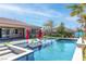 Beautiful backyard pool with tanning deck, lounge chairs, umbrellas and a well manicured yard in a modern home at 274 Chartan Ave, Las Vegas, NV 89183