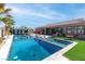 Backyard pool features sunbeds, outdoor seating, a covered patio, and lush landscaping at 274 Chartan Ave, Las Vegas, NV 89183