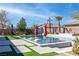Beautiful backyard pool with tanning deck, lounge chairs, umbrellas and a well manicured yard in a modern home at 274 Chartan Ave, Las Vegas, NV 89183