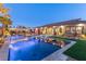 Tranquil pool with sun umbrellas creating an enchanting evening ambiance and inviting relaxation and leisure at 274 Chartan Ave, Las Vegas, NV 89183