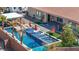 Resort-style pool featuring submerged loungers and sun umbrellas for ultimate relaxation and backyard luxury at 274 Chartan Ave, Las Vegas, NV 89183