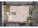 An aerial view of a single-story home featuring a courtyard, desert landscaping, and a unique water feature at 2822 Soft Horizon Way, Las Vegas, NV 89135