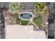 Aerial view of home with stone exterior, backyard spa and patio at 2822 Soft Horizon Way, Las Vegas, NV 89135