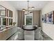 Elegant dining room with round table, ambient lighting, designer decor, and a view of outdoor greenery at 2822 Soft Horizon Way, Las Vegas, NV 89135