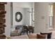 Modern dining room with stylish lighting and a round mirror near the living room at 2822 Soft Horizon Way, Las Vegas, NV 89135