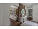 Stunning foyer with stone wall accents opening to the living room with abundant natural light at 2822 Soft Horizon Way, Las Vegas, NV 89135