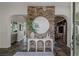 Elegant foyer with a stone accent wall, decorative console table, and slate tile flooring at 2822 Soft Horizon Way, Las Vegas, NV 89135
